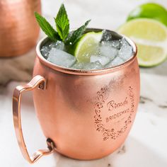 a copper mug filled with ice and lime