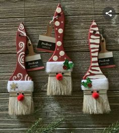 three christmas decorations hanging on a wooden wall