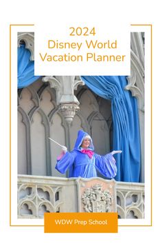 the disney world vacation planner is on display in front of a building with blue drapes