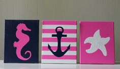 three canvases with seahorses, an anchor and a starfish on them