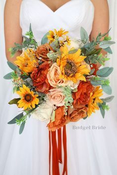 a bridal bouquet with sunflowers, roses and greenery is the focal point for this bride's bouquet