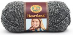 a skein of yarn with the name heartland on it in grey and brown