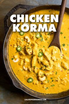 chicken korma in a skillet with a wooden spoon and title overlay reads chicken korma