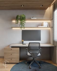 an office space with a desk, chair and computer monitor on top of the desk