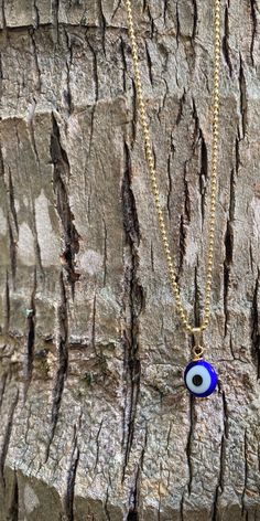 "This necklace is combination of -Handmade Blue Evil Glass bead. -18\" Gold Filled Chain . 🧿The evil eye is a curse or legend believed to be cast by a malevolent glare, usually given to a person when they are unaware. ... Talismans or amulets created to protect against the evil eye are also frequently called \"evil eyes\".🧿" Blue Beaded Charm Necklaces With Round Beads, Blue Spiritual Beaded Chain Necklace, Blue Beaded Chain Spiritual Necklace, Blue Beaded Chain Necklace With Spiritual Style, Gold Beaded Necklaces With Evil Eye For Gifts, Blue Beaded Necklaces With Adjustable Chain, Blue Beaded Necklace With Adjustable Chain, Handmade Blue Pendant Charm Necklace, Adjustable Blue Chain Necklace As Gift