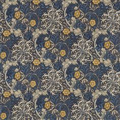 an ornate blue and yellow wallpaper with flowers on the left hand side, is shown in full color