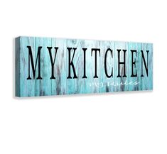 a wooden sign that says my kitchen on the side of a white wall with blue paint