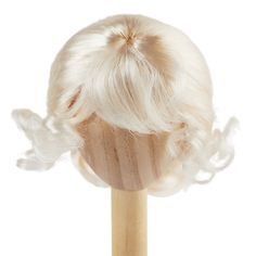 a wig on top of a wooden stick