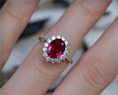 Classic Royal Style oval Ruby ring, made with 925 sterling silver, plated with white gold. Main Stone: 7*9 mm lab Ruby Side Stone: CZ CS079 Custom order accepted, if need different stone or material, just feel free to contact.:) Home page: https://www.etsy.com/shop/CarrieStudio?ref=seller-platform-mcnav Elegant Oval Lab-created Ruby For Weddings, Oval Party Ring With Center Stone, Oval Ruby Ring For Party, Oval Ruby Ring For Parties, Formal Oval Lab-created Ruby Jewelry For Weddings, Oval Halo Setting Rings For Party, Elegant Ruby Wedding Ring With Halo, Oval Brilliant Cut Party Ring, Elegant Formal Ruby Halo Ring