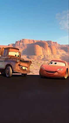 two cars are in the middle of a desert scene, one is orange and the other is red