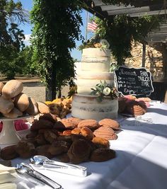 a table topped with lots of different types of cakes and desserts on top of it