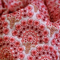 red and white floral print fabric with small flowers