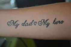 a person with a tattoo on their arm that says, my dad is my hero