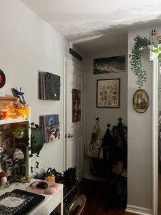 the hallway is cluttered with various items and decorations on the wall, along with other things