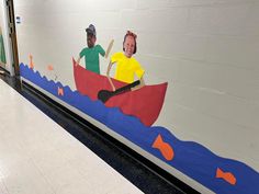 a mural on the side of a wall depicting two people in a canoe