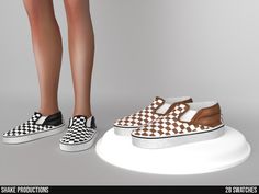 a pair of women's shoes with brown and white checkerboard on them