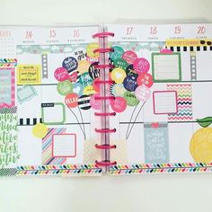 an open planner with lots of stickers on it