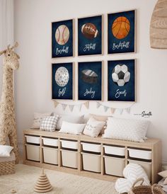 a child's room with sports themed artwork on the wall and storage bins