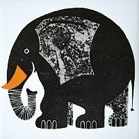 an elephant with orange tusks standing in front of a white wall and trees