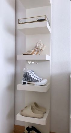 there is a shoe shelf with shoes on it