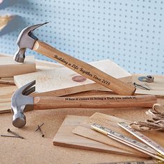 a hammer and some woodworking tools on a table