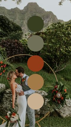 a bride and groom kissing in front of an arch decorated with flowers, greenery and foliage