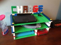 a stack of lego letters sitting on top of a wooden table