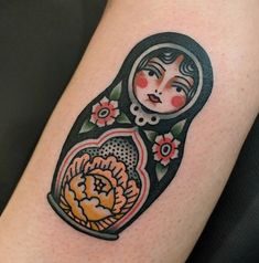 a tattoo with an image of a woman holding a flower