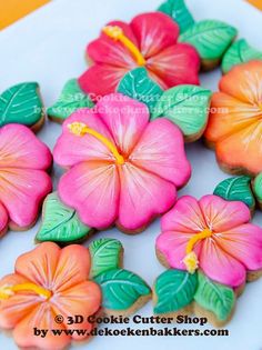 some cookies decorated with flowers on a plate