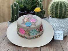 "This beautiful Mexican Hat is stylish and is completely unique in design, perfect to add that special touch to any outfit. This structured palm hat is often referred to as a women \"boater\" hat with its flat crown. The wide brim is accented by a hand painted band. The hat itself is made out of high quality jute and is very light and breathable. It is handmade and hand painted by Mexican Artisans in Mexico." Multicolor Hat Bands For Kentucky Derby, Multicolor Bohemian Straw Hat For Kentucky Derby, Bohemian Multicolor Straw Hat For Kentucky Derby, Multicolor Flat Brim Sun Hat For Kentucky Derby, Handmade Multicolor Flat Brim Fedora, Multicolor Curved Brim Hat Band For Kentucky Derby, Whimsical Multicolor Sun Hat With Curved Brim, Multicolor Fedora For Kentucky Derby, Artistic Multicolor Wide Brim Hats