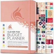 the clever and colorful planner book is open to show it's cover pages, which are