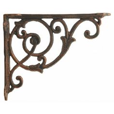 an ornate iron shelf bracket on a white background