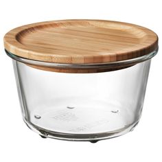 a glass jar with a wooden lid