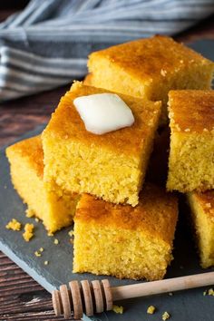 several pieces of cornbread with butter on top