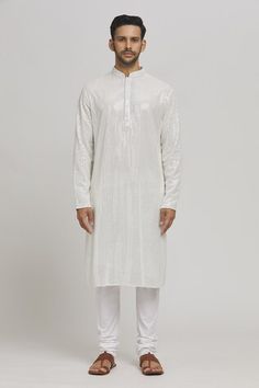 White cotton kurta with mirror and thread embroidery. Comes with churidar. - Aza Fashions White Sherwani With Mirror Work For Eid, Diwali White Sherwani With Mirror Work, Traditional Churidar With Mirror Work For Puja, White Chanderi Sherwani With Mirror Work, Diwali Kurta With Mirror Work For Puja, Festive Churidar With Mirror Work For Puja, Traditional Mirror Work Churidar For Puja, Chanderi Kurta With Mirror Work For Puja, White Chanderi Sherwani For Puja