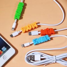 an iphone and two usb devices connected to each other with the word mama spelled out on them