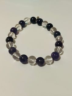 Carry your crystals everywhere you go. Our specially designed handmade Gracefully Grounded bracelets are made of natural Amethyst and Crystal Quartz Crystals, bracelets come in different sizes according to your wrist measurements, and for children too. Wear them to help keep your energy calm and grounded, your mind clear and focused, they can be a wonderful gift for your friends, family, and loved ones too! Available in flexible sizes for adults and children. For adults - $18 For children - $13 Handmade Crystal Bracelet For Meditation, Round Hypoallergenic Crystal Bracelet For Healing, Hypoallergenic Round Crystal Bracelet For Healing, Adjustable Amethyst Round Bead Crystals, Adjustable Amethyst Natural Stone Crystals, Handmade Round Crystals For Meditation, Healing Mineral Crystal Bracelet, Round Crystal Bracelet With Natural Stones For Healing, Handmade Amethyst Crystal Bracelet