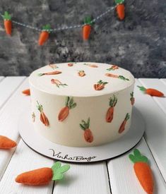 there is a cake with carrots on it