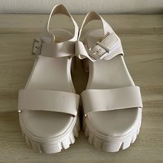 Fashion Nova Platform Sandals With Velcro Buckle Color: Off-White Size: U.S.- 8.5. Uk- 39 Condition: Brand New Platform Height: 2 Inches White High Heel Sandals With Buckle, White High Heel Sandals With Buckle Closure, Trendy Cream Ankle Strap Sandals, White Wedge Sandals With Buckle Closure And Open Heel, White Open Heel Wedge Sandals With Buckle Closure, White Sandals With Buckle Closure For Spring, White Casual Wedge Sandals With Buckle Closure, Casual Cream Heels With Buckle Closure, Cream Ankle Strap Sandals In Synthetic Material