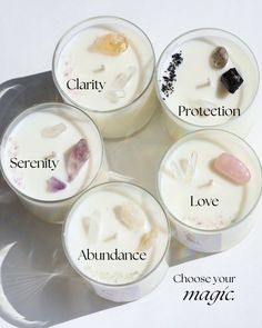 four candles with different types of crystals in them