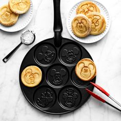 mickey mouse waffles are being made on a pan