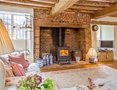 a living room filled with furniture and a fire place