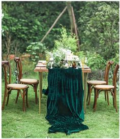 the table is set with green velvet cloth