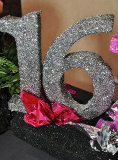 a close up of a glitter number on a table