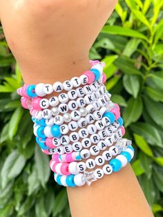 This listing is for a 10 pack of Sabrina Carpenter bracelets. They are custom made and will make the most perfect accessory to your concert outfit or the perfect gift for a super fan! Colors, patterns and sizes may vary slightly. You will receive the 10 sayings in the listing but if you would like different phrases please let I know when placing your order. You can share favorite colors of choice, favorite song titles, phrases, etc. Each bracelet is made with pony beads, letter beads and clear stretch cord. Perfect for easy trading/swapping, but be careful when pulling them on or off. Bracelet Ideas With Pony Beads, Sabrina Carpenter Bracelet Ideas, Pony Beaded Bracelets, Sabrina Carpenter Bracelets, Pony Bead Bracelets Ideas, Swiftie Bracelets, Concert Bracelets, Sabrina Carpenter Outfits