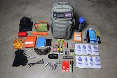 an assortment of emergency items laid out on the floor