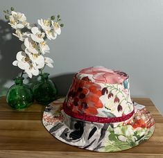 This pretty, reversible bucket/sun hat can be worn on both sides since it features two patterns,(as shown in photos) basically two hats in one.  Pick a mood and you got a hat. Makes a nice gift for someone who spends lots of time outdoors.  Hat inside circumference measures 24" for adults with a larger head. (will be loose on most adults) Fun Reversible Sun Hat For Vacation, Fun Reversible Hat For Vacation, Reversible Multicolor Wide Brim Sun Hat, Fun Reversible Hats With Curved Brim, Fun Reversible Hat With Curved Brim, Fun Reversible Sun Hat With Curved Brim, Reversible Flat Brim Bucket Hat For Vacation, Reversible Wide Brim Bucket Hat One Size, Fun Reversible Vacation Hat