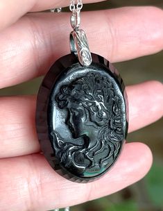 "Big, long, cameo, oval, natural, black onyx pendant necklace set in 925 sterling silver, with 18\" sterling silver chain. Stone Size: 40mm x 30mm. 17 Grams Stone Weight/85-carats." Black Round Cameo Jewelry, Black Oval Jewelry With Large Pendant, Black Intaglio Jewelry As A Gift, Formal Black Cameo Jewelry, Black Cameo Medallion Jewelry, Black Cameo Medallion Necklace, Black Cameo Necklace As A Gift, Black Cameo Necklace Gift, Black Cameo Jewelry For Gifts