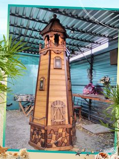 a wooden clock tower sitting under a metal roof