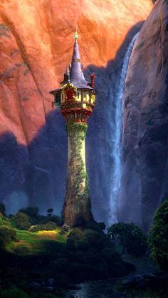 a tall tower with a waterfall in the background